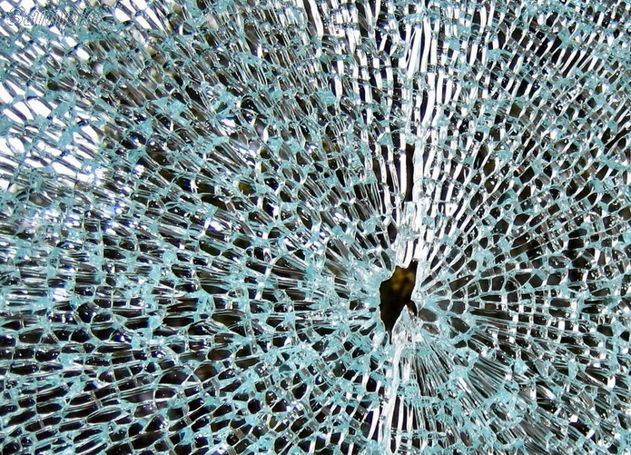 An example of the characteristic destruction of tempered glass from a strong point impact