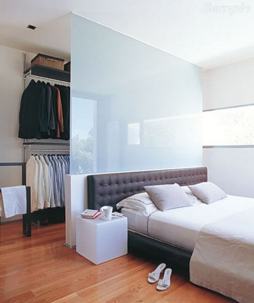 Glass partition separates the wardrobe from sleeping space