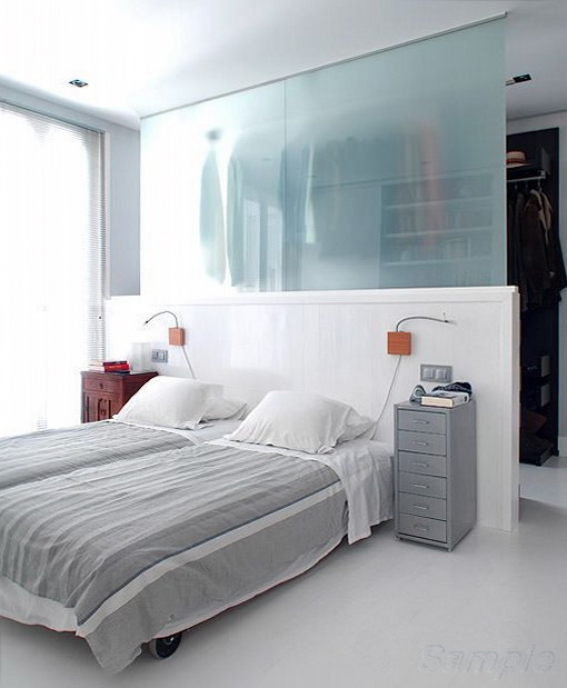 Glass partitions can be used to separate the sleeping area and wardrobe