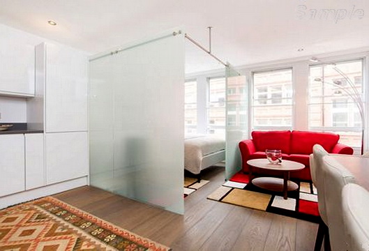 Glass partitions in a studio apartment