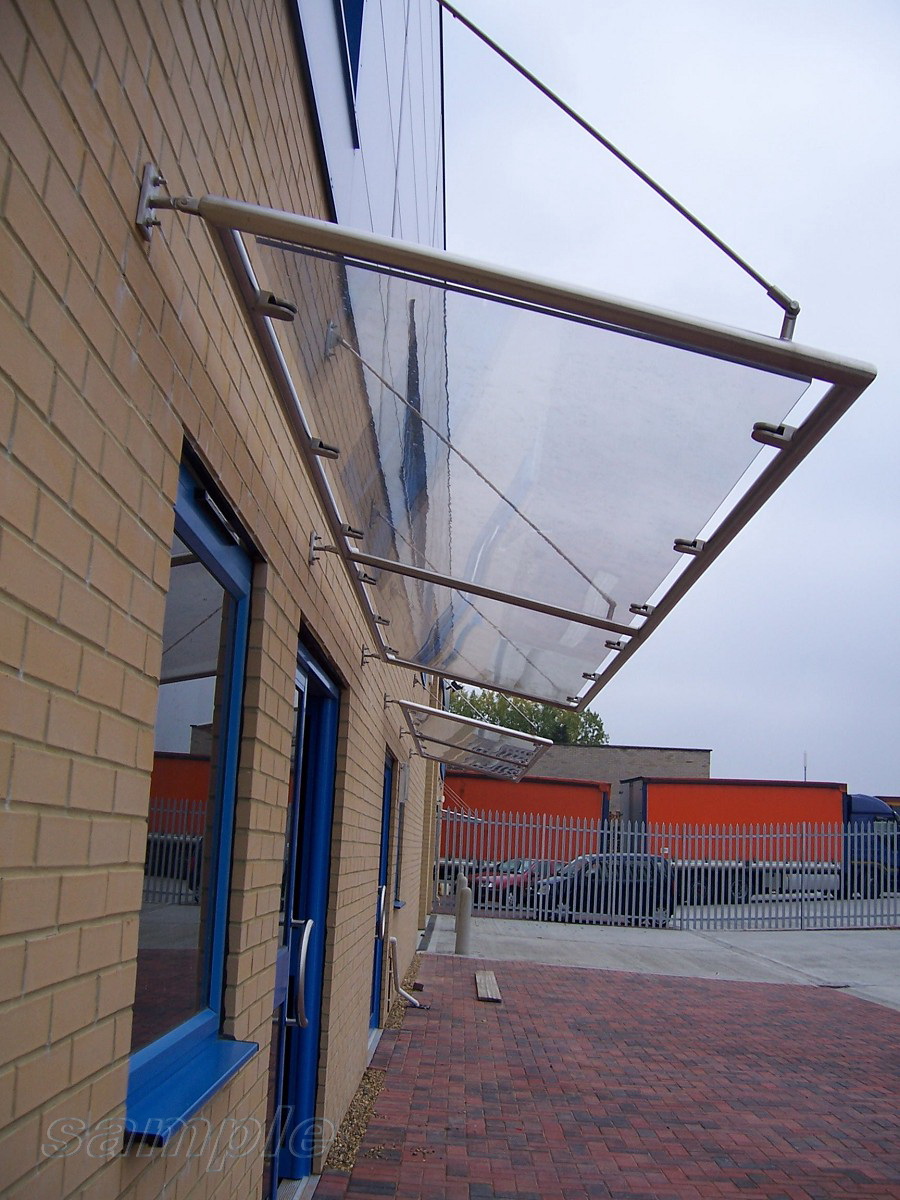 Glass canopy on truss rods with frame understructure