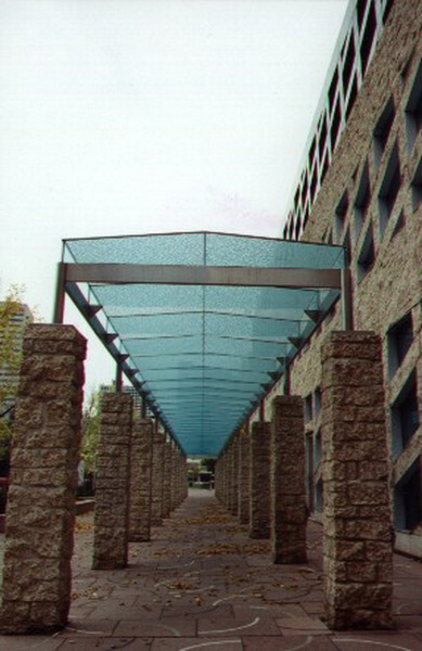 Decorative glass overhang above pedestrian zone