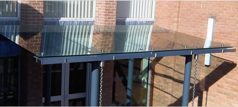 A glass overhang - a way of integrating a storefront into an office building