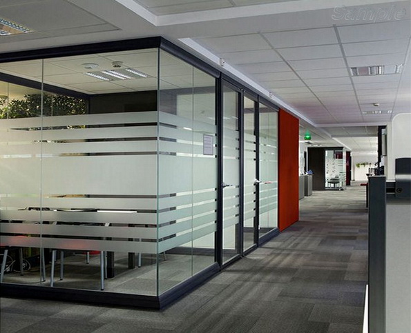 Glass office partitions with a swing door in an aluminum frame