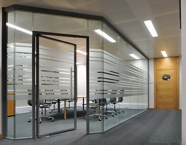 Glass office partitions with a swing door in an aluminum frame