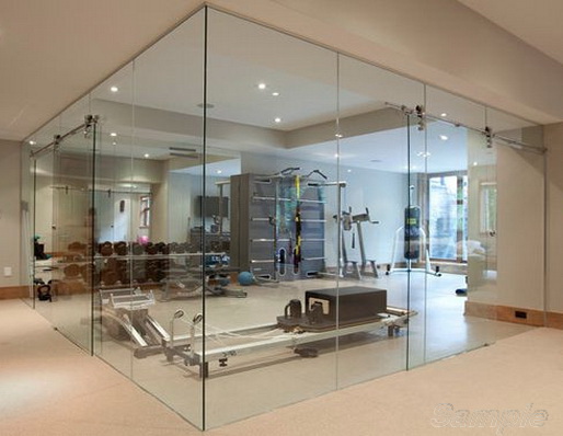 Glass partitions with sliding door in gym