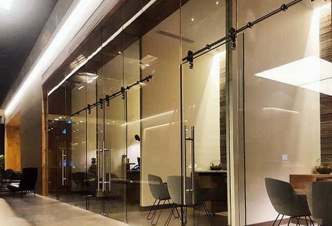 Glass office partitions with sliding door
